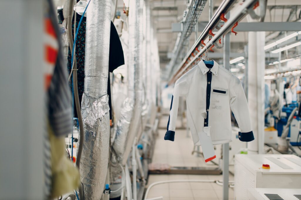 Dry cleaning clothes. Clean cloth chemical process. Laundry industrial dry-cleaning